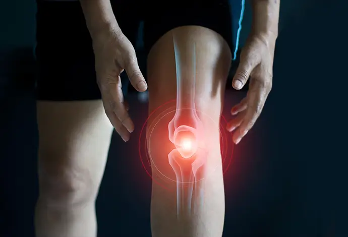 Elderly woman suffering from pain in knee