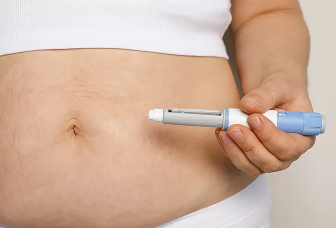 Woman hand with semaglutide injection pen