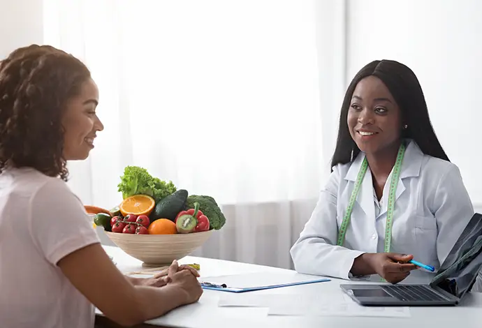 Doctor discussing medical weight loss options with patient at Saint Louis Pain Center